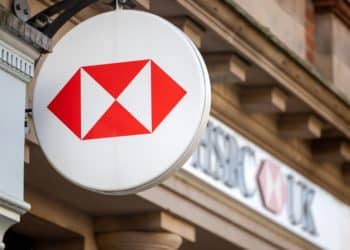 A sign above HSBC Holdings Plc bank branch, that is due to close, in Windsor, UK, on Tuesday, Dec. 6, 2022. HSBC Holdings Plc has announced plans to shutter more than 100 of its UK branches next year as the bank pushes more of its customers to use its online services. Photographer: Jason Alden/Bloomberg